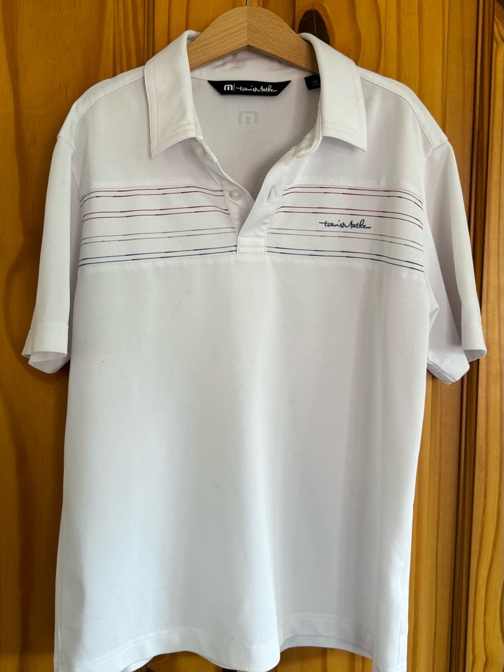Travis Mathew White Polo with Thin Stripe Detail